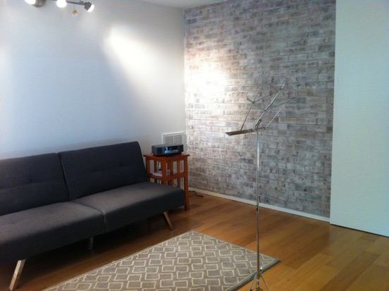 New Practice Room in Basement Renovation: whitewashed brick wall, new wall finish, acoustic treatment