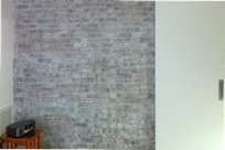Whitewashed Brick wall with sliding door